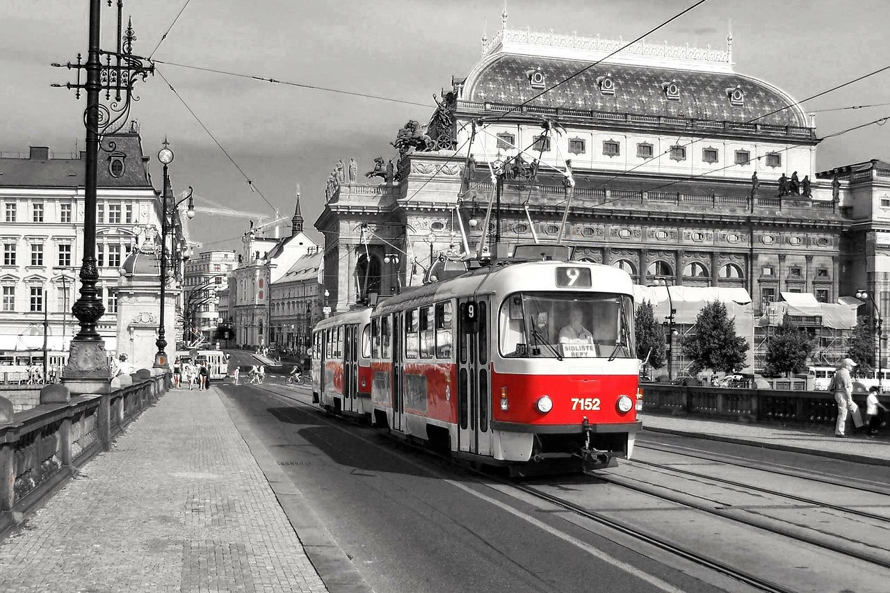 Historical Prague Tram passing by the Czech National Theater