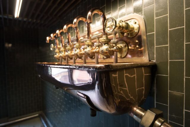 Copper taps of beer at U Fleku Pub and Restaurant in Prague.